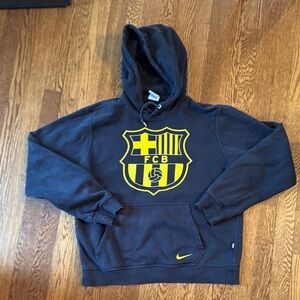 Nike Men's Dark Blue Hoodie with Yellow Emblem